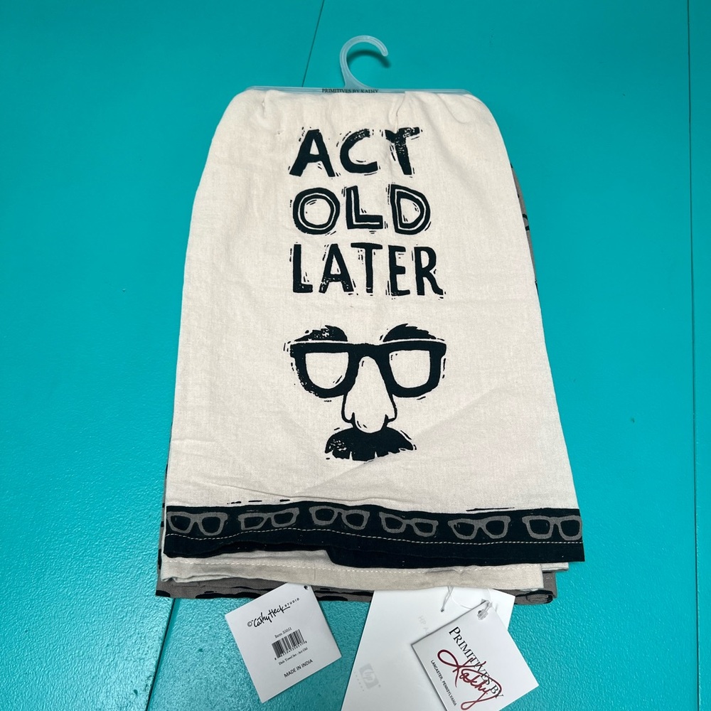 Act old later tea towel set